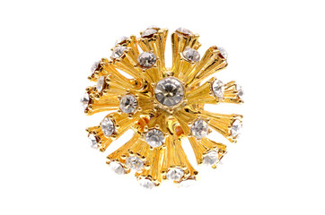 brooch in the form of the sun on a white background