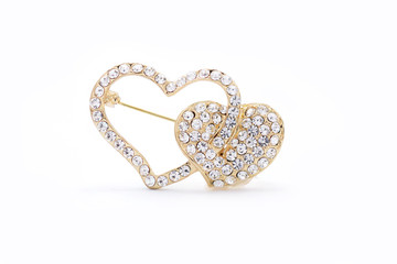 brooch in the form of heart on a white background