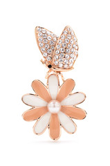 Brooch butterfly on a flower on a white background