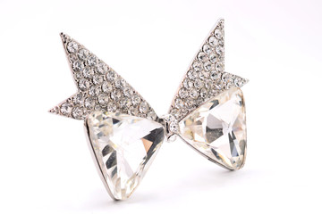 brooch in the shape of a bow on a white background