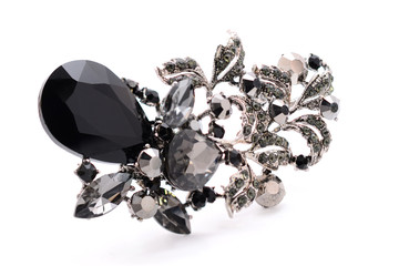 onyx brooch on a white background