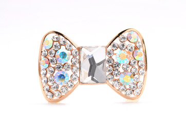 brooch in the shape of a bow on a white background