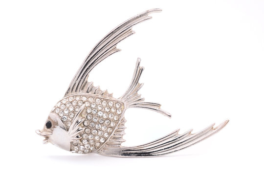 brooch in the form of a fish on a white background