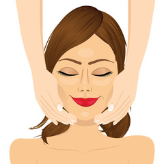 attractive young woman enjoying facial massage beauty therapy