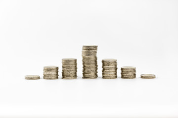 2 euro coins stacked and scattered some of 1 euro isolated on a white background
