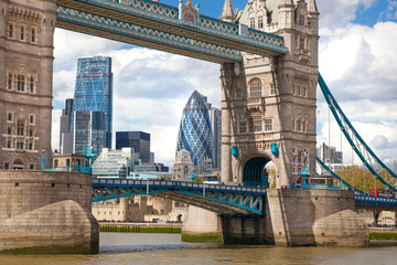 LONDON, UK - APRIL 30, 2015: Tower bridge and City of London financial aria on the background. View includes Gherkin and other buildings