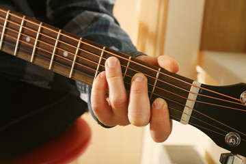 Fototapeta na wymiar Close up view on playing guitar