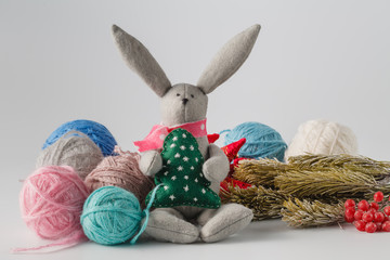 Handmade felt toy with colored wool clew