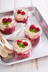 Colorful and delisious dessert in a jar berry cramble