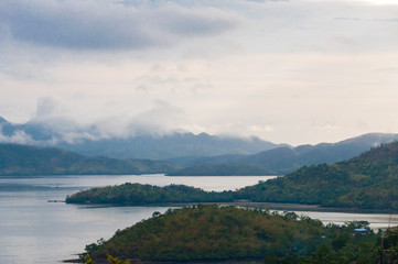 Big green Islands with fog and mist at the coast of Coron