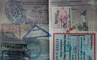 Visa stamps in United States passport including those for Nepal, South Korea, Thailand and the United Arab Emirates
