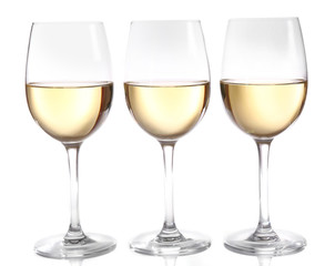 Three glasses of wine on light background