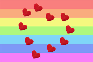 Heart of the little red hearts on a rainbow background