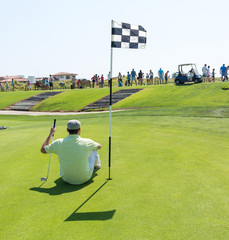 Man playing golf at club