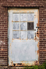 Grunge door on abandoned building