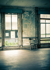 View inside empty room with chair of abandoned building