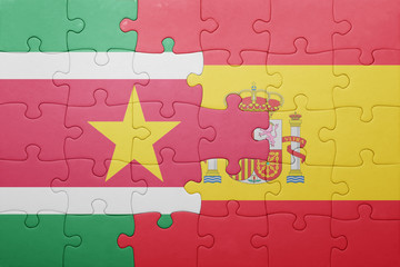 puzzle with the national flag of spain and suriname