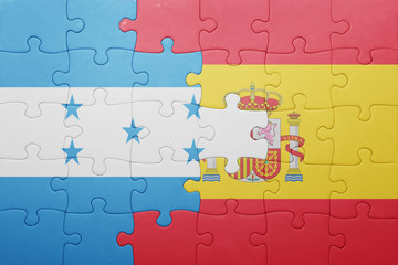 Fototapeta premium puzzle with the national flag of spain and honduras