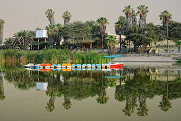 Lake and sand dunes near Huacachina, Ica region, Peru.