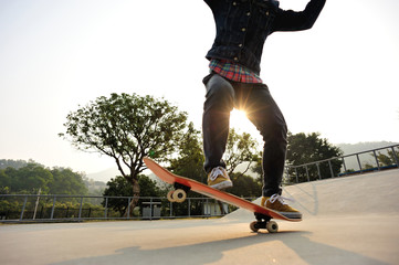 Fototapeta na wymiar skateboarding at sunrise skatepark