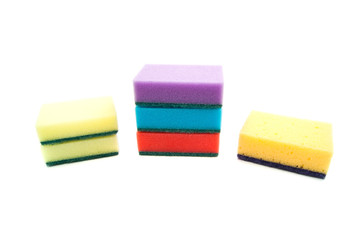 different colored sponges on white