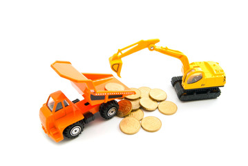 euro coins, backhoe and orange truck