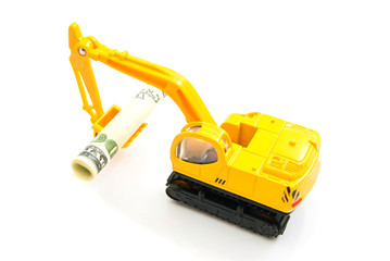 Fototapeta premium dollars banknotes and backhoe on white