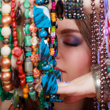 Pretty woman with jewelry necklaces bracelets