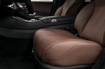 Prestige car interior background. Driver's leather seat.