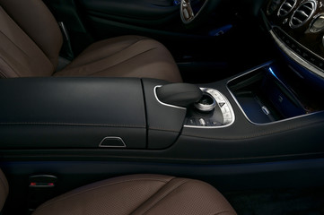 Luxury car interior background. Dashboard control buttons.
