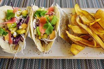 Fresh vegetable tacos with plantain chips © eqroy