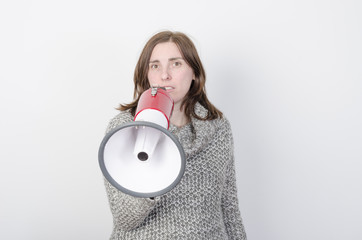 Young woman speaks through megaphone.