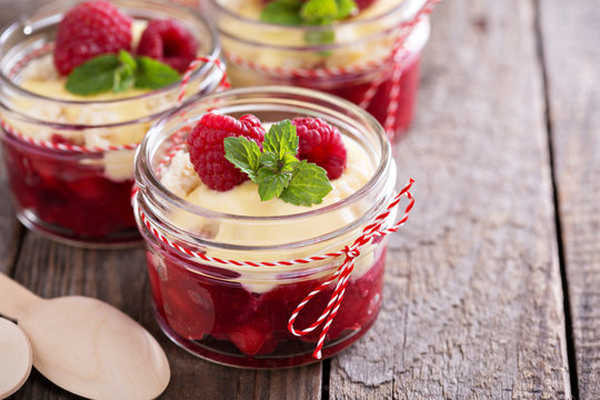 Colorful and delisious dessert in a jar berry cramble