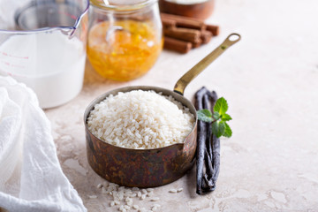 Raw rice in a measuring cup ready to be cooked