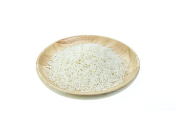 Close up Thai jasmine rice in wooden bowl isolated on white