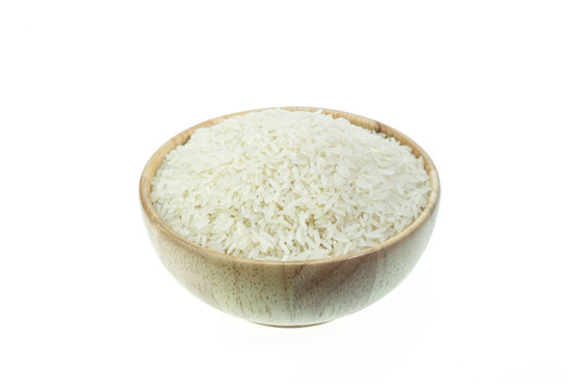 Close up Thai jasmine rice in wooden bowl isolated on white