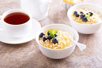Cooked millet porridge with lemon curd and blueberry