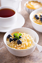 Cooked millet porridge with lemon curd and blueberry