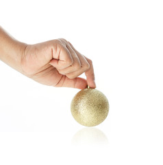 Close up hand holding Christmas ball isolated on white background