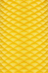 textured surface of yellow candle