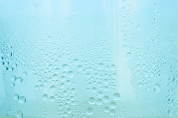 Drops water on the clear glass background