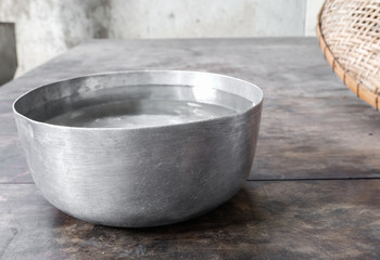 Thai water bowl on the wooden