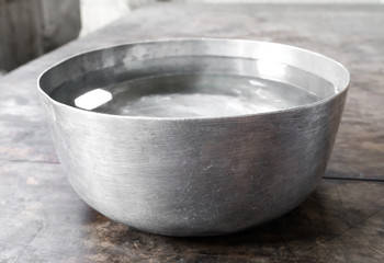 Thai water bowl on the wooden
