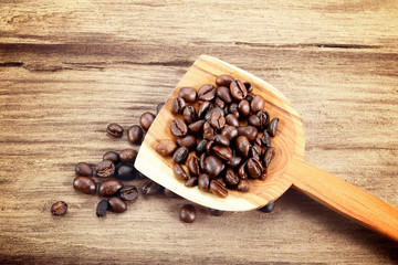 Coffee beans on wood background