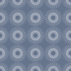 Seamless floral vector pattern; symmetrical abstract background with flowers, on the blue backdrop