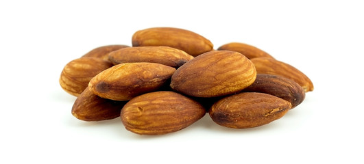 Macro of healthy raw shelled almonds isolated on white