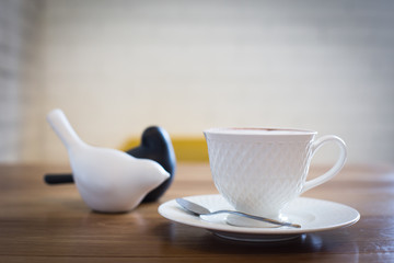 Hot art Latte Coffee in a cup on wooden table.