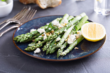 Warm salad with asparagus, feta cheese and lemon