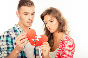 Portrait of sad young couple because of break