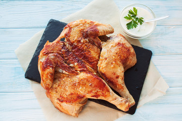 Rosted chicken on a slate plate